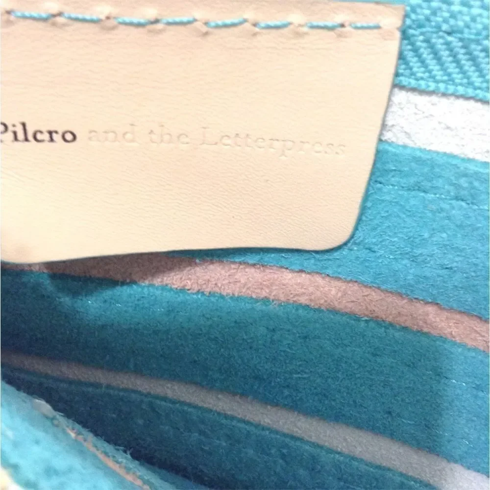 Anthropologie’s Pilcro and The Letterpress Leather Wristlet